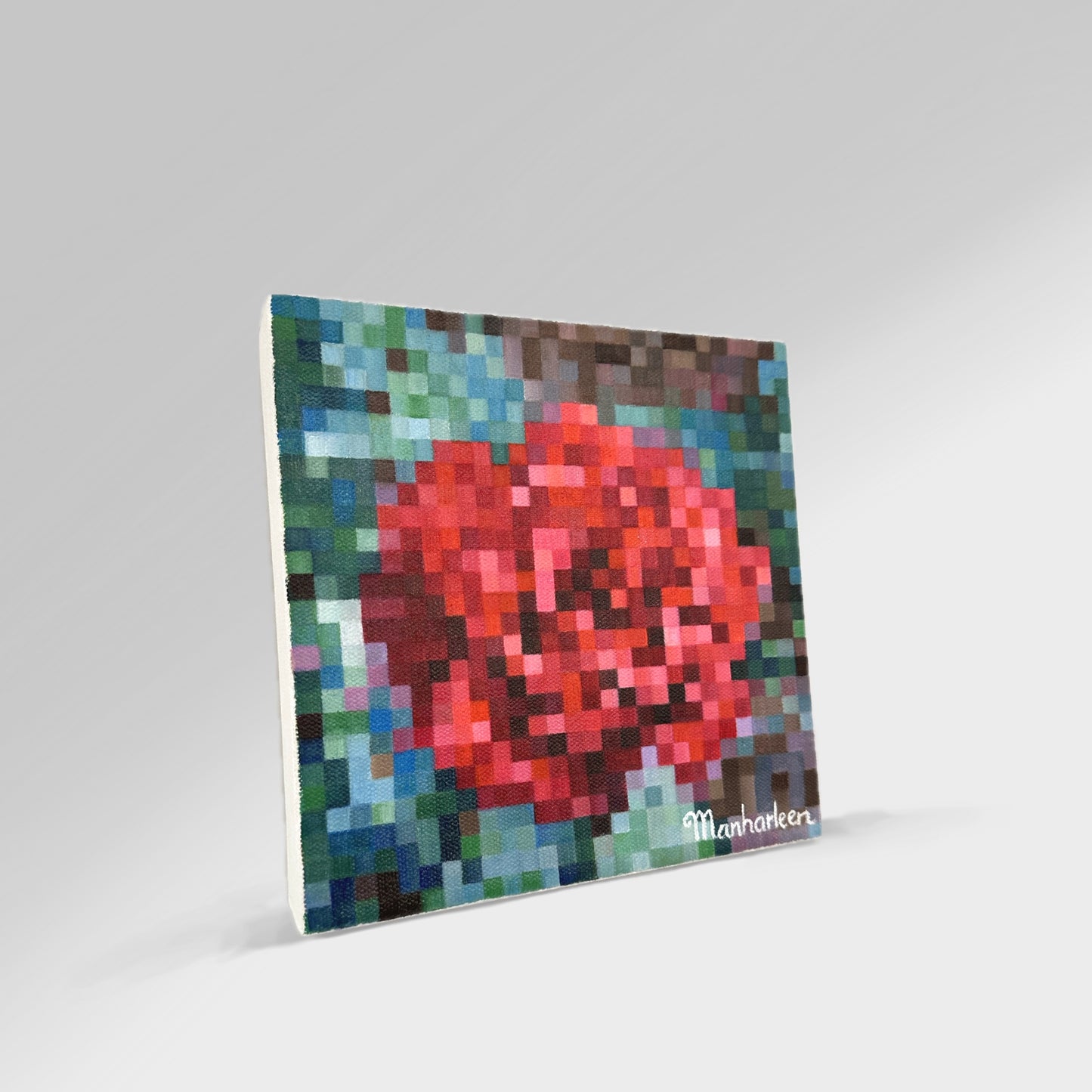 Side angle shot of an 8x8 inch (20.3x20.3 cm) rose painting, highlighting the rich texture and vibrant colors of the red bloom and green leaves, crafted in a distinctive square art technique, ideal for enhancing any room.