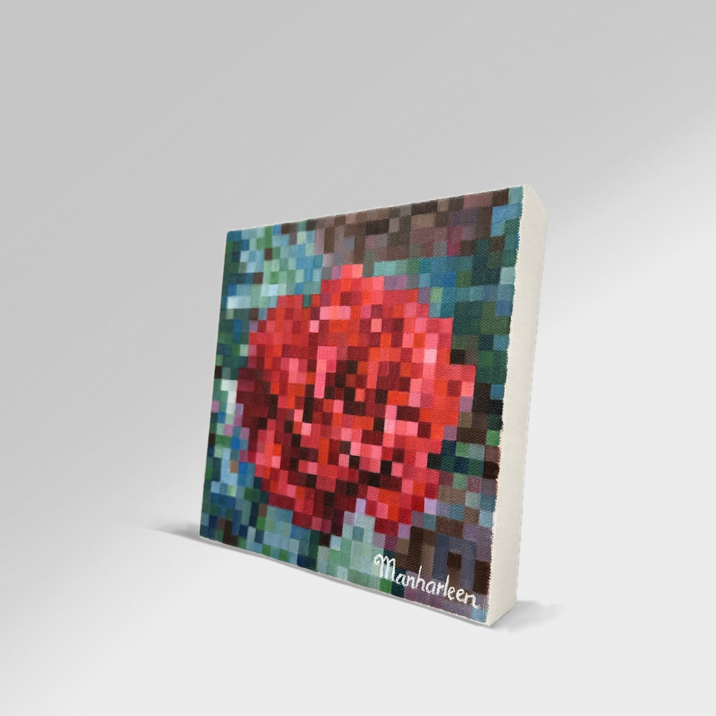 Side angle shot of an 8x8 inch (20.3x20.3 cm) rose painting, highlighting the rich texture and vibrant colors of the red bloom and green leaves, crafted in a distinctive square art technique, ideal for enhancing any room.